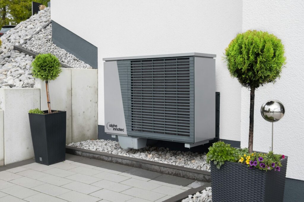 pexels photo 20046694 20046694 Modern air conditioning unit with flower pots and sleek decor outdoors.